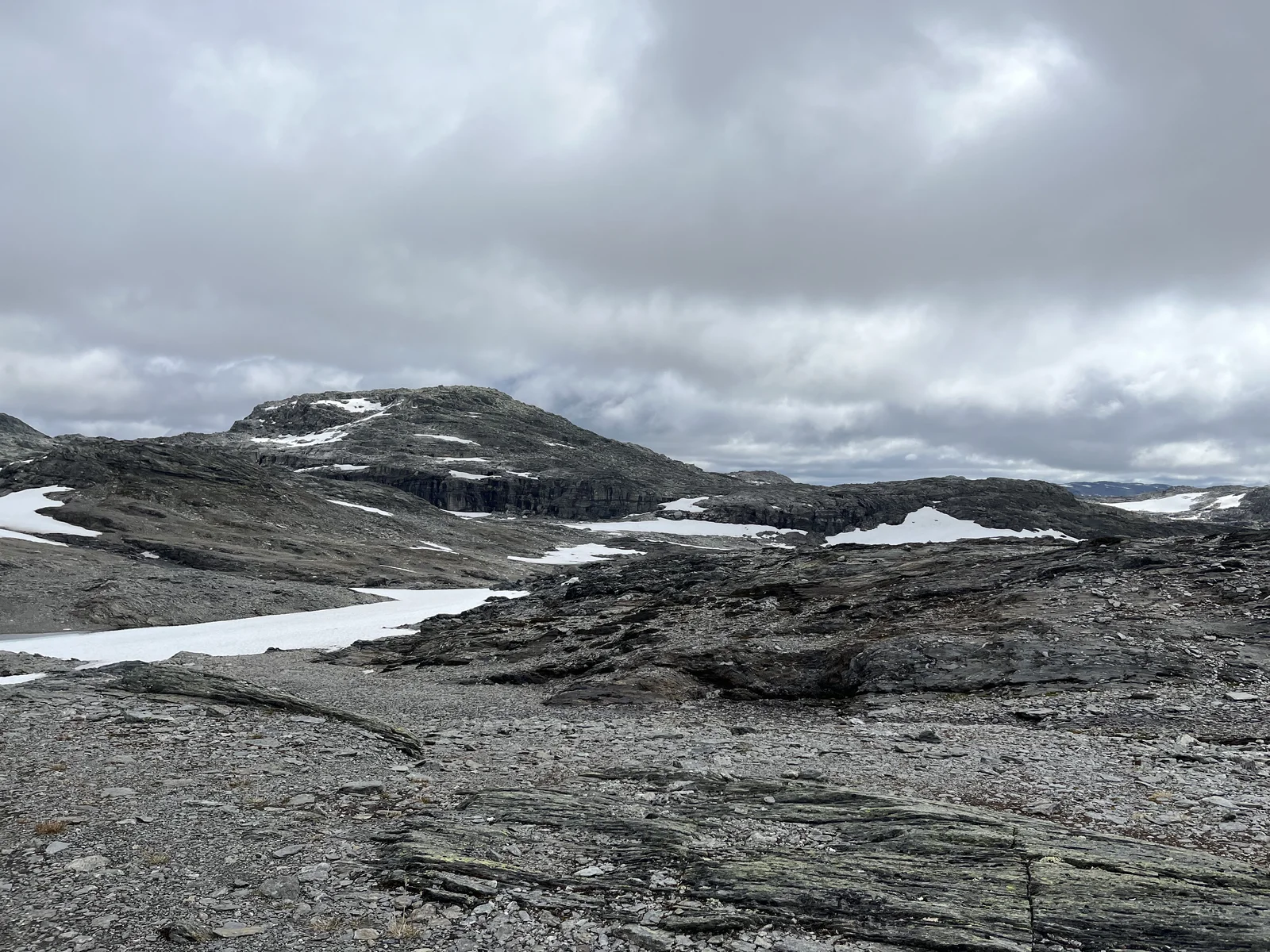 Rocky Norwegian highlands with lingering patches of snow