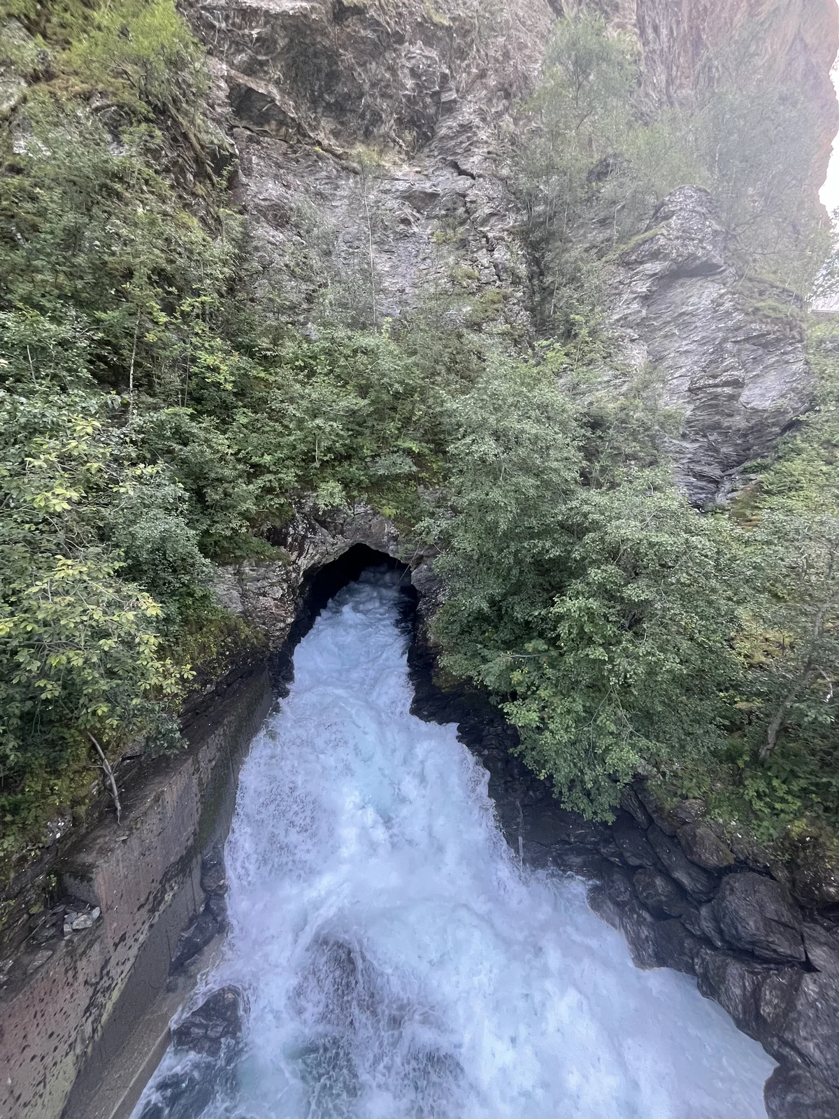 White water rushing between dark rock walls in Norway
